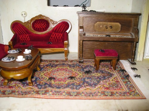 Picture of dollhouse living room invaded by ants